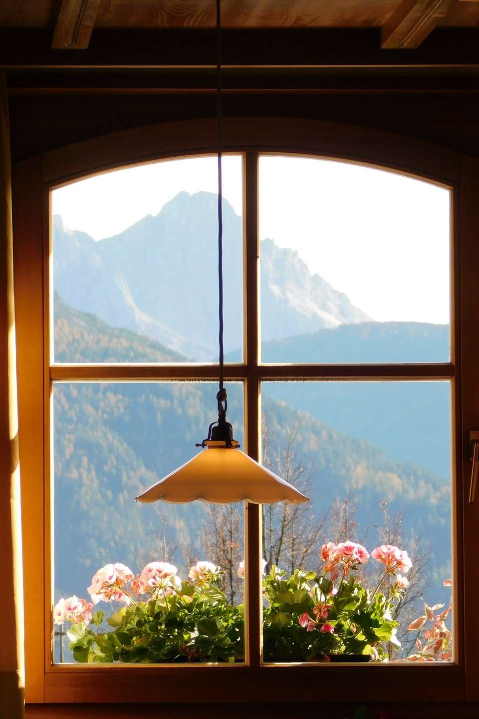 sparkling clean window framing a mountain view